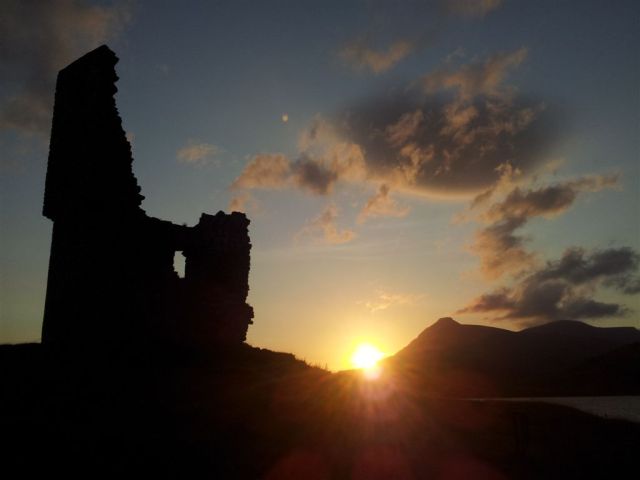 Sun setting over Ardvreck Castle & the Quinag Sun setting over Ardvreck Castle & the Quinag