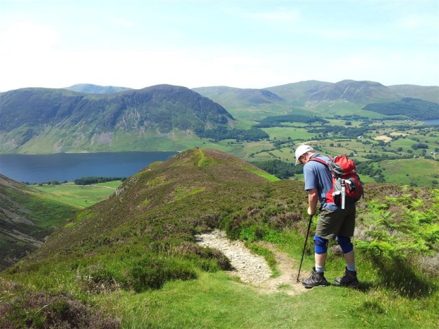 A man with highly honed mountain fitness and Crummock Water & Mellbreak