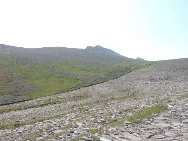 Glimpses of pointy things across a flat rock dessert Glimpses of pointy things across a flat rock desert